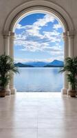 An archway leads to a large room with a view of the water photo