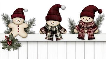 Three snowmen wearing scarves and hats on a white fence photo