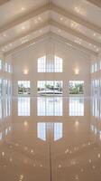 A large white building with windows and a large floor photo