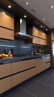 A modern kitchen with black and brown cabinets photo