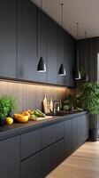 A modern kitchen with black cabinets and wooden floors photo