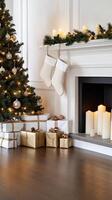 Christmas tree and presents in front of fireplace photo