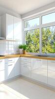A clean white kitchen with a window and a sink photo