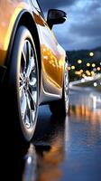 A car is driving on a wet road photo
