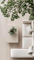A white couch and a tree in a room photo