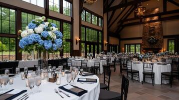 A wedding reception with blue and white flowers photo