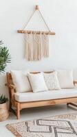A wooden sofa with pillows and a rug photo
