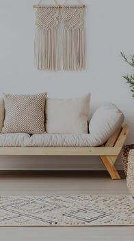 A white couch with pillows and a rug photo