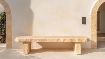 A bench sitting in front of a wall photo