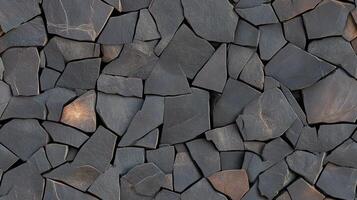 A stone wall with many different shapes photo