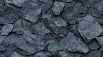 A large pile of rocks that are dark blue photo