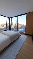 A bedroom with a view of the city photo