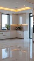 A modern kitchen with white cabinets and marble floor photo