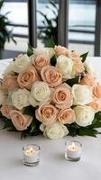 A table with a bunch of roses and candles photo