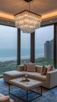A living room with a large window overlooking the ocean photo