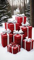 A group of red gift boxes in the snow photo