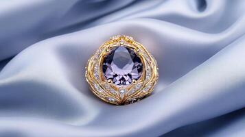 A purple stone is sitting on a gold background photo