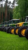 A row of green and yellow tractors in a field photo