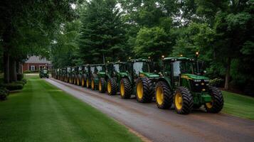 A row of green tractors lined up on a road photo