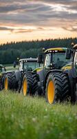 A group of tractors parked in a field photo
