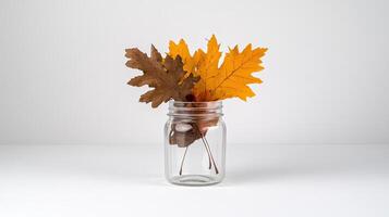 A glass jar with leaves in it photo