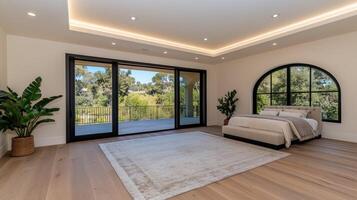 A bedroom with a large bed and sliding glass doors photo