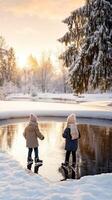 Two children playing in the snow photo