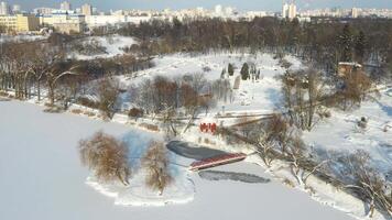 An island on a lake with a bridge in the winter Loshitsky Park.Minsk, BelarusAn island on a lake with a bridge in the winter Loshitsky Park.Minsk, Belarus video