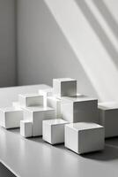 A group of white cubes sitting on top of a table. photo