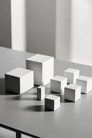 A group of white cubes sitting on top of a table. photo