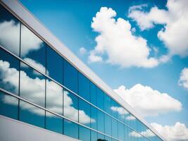 A building with a large glass window and clouds in the sky photo