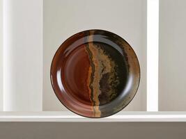 Large Round Ceramic Plate with Earthy Tones and Glossy Finish Ideal for Serving Food or Displaying Decorative Items in Kitchen Settings photo