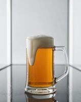 Refreshing cold beer mug with foam on clear background photo