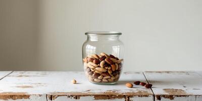 Mixed Nuts in a Jar on Rustic Wooden Table - Healthy Snack photo