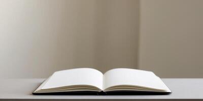 An open notebook with blank white pages lies on a flat surface photo