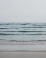 Peaceful Shoreline with Blue Ocean Waves Background photo