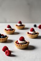 Delicious Raspberry and Cream Mini Pies with Berries photo