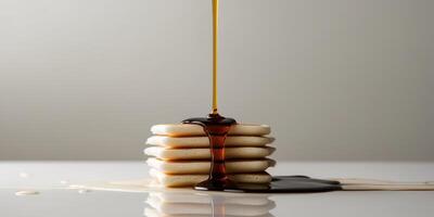 Stunning Macro Shot of Syrup Cascading Down Stack photo