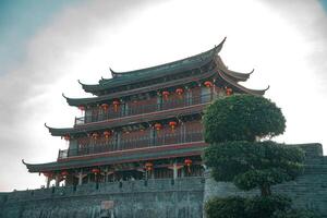Traditional Asian Architecture featuring Beautiful Lanterns set in a Scenic and Serene Setting photo