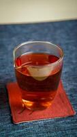 A warm mug of tea placed on a beautiful coaster, perfect for a calming afternoon vibe photo