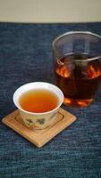 An Aesthetic Tea Display Featuring Both Traditional and Modern Styles of Glassware photo