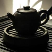 An Elegant Teapot Silhouette Gracefully Displayed on a Stylish and Chic Tea Tray photo