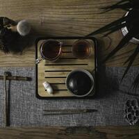 An Elegant Tea Setup Artfully Displayed on a Beautiful Wooden Table for Enjoyment photo