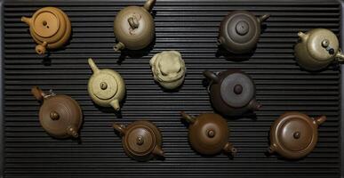 A Beautiful Collection of Assorted Teapots Available in Various EyeCatching Shades and Styles photo