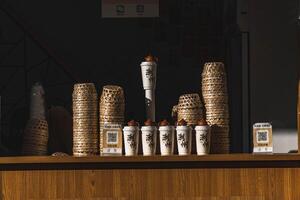A beautiful and elegant artisan coffee display featuring stylish containers and charming cups photo