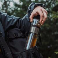 Engage in an exciting Outdoor Adventure equipped with a Travel Tea Infuser and Water Bottle photo