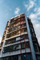An Urban Building Featuring a Unique Rustic Design with Vintage Character Elements photo