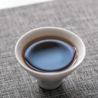 An elegantly crafted teacup filled with rich brew for a delightful and satisfying sip photo
