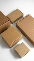 Sturdy brown cardboard boxes in various sizes for shipping and storage purposes photo
