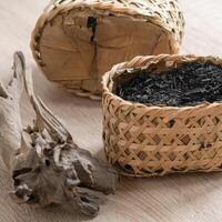 A Beautiful Collection of Natural Dried Herbs Presented in a Handmade Decorative Basket photo